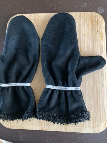 Reviewer's handmade black mittens made from the fabric, showing the suede outside and sherpa fleece at the cuffs.