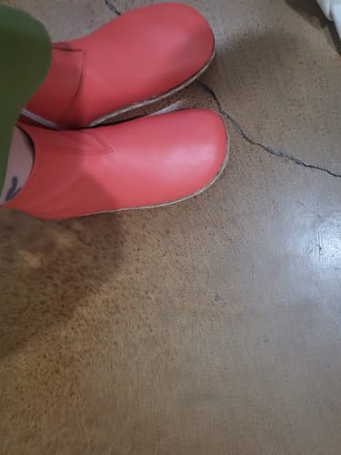 Overhead view of a customer's feet in red leather Zero Drop Barefoot Boots.