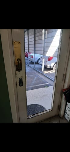 Customer's door with an old full glass pane before installing the Venting Glass and Frame Kit.