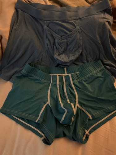 Customer's comparison of the slate Modal 7in Boxer Briefs with V-Fly (top) and shorter teal briefs (bottom).