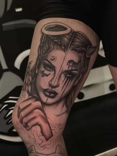 Reviewer's large black and grey tattoo on their inner thigh, completed using the Painless Tattoo Numbing Spray.