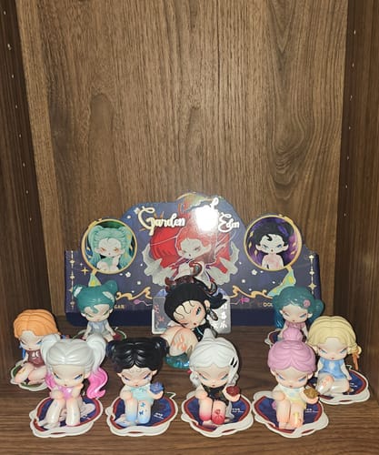 Customer's collection of DODO Nami Garden of Eden mini figures displayed on a shelf in front of the product box.