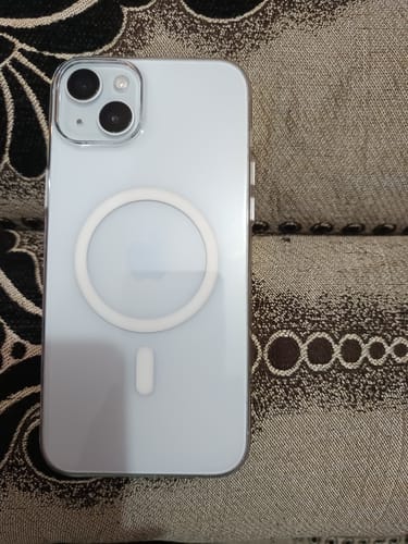 Customer's phone, protected by UltraShield Tempered Glass, shown from the back in a clear MagSafe case.
