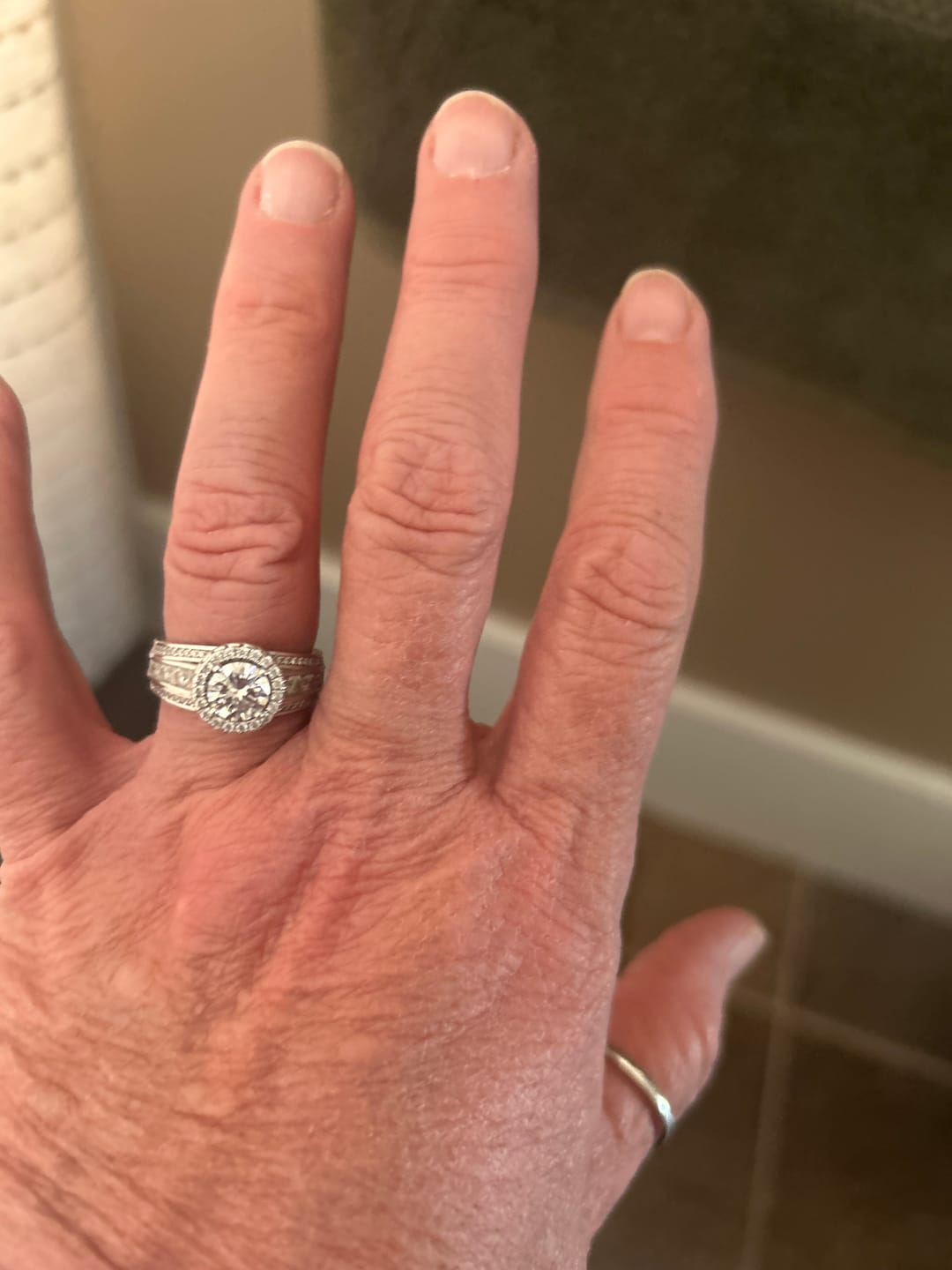 Customer photo review of Halo Moissanite Graduated Triple Row Pave Engagement Ring