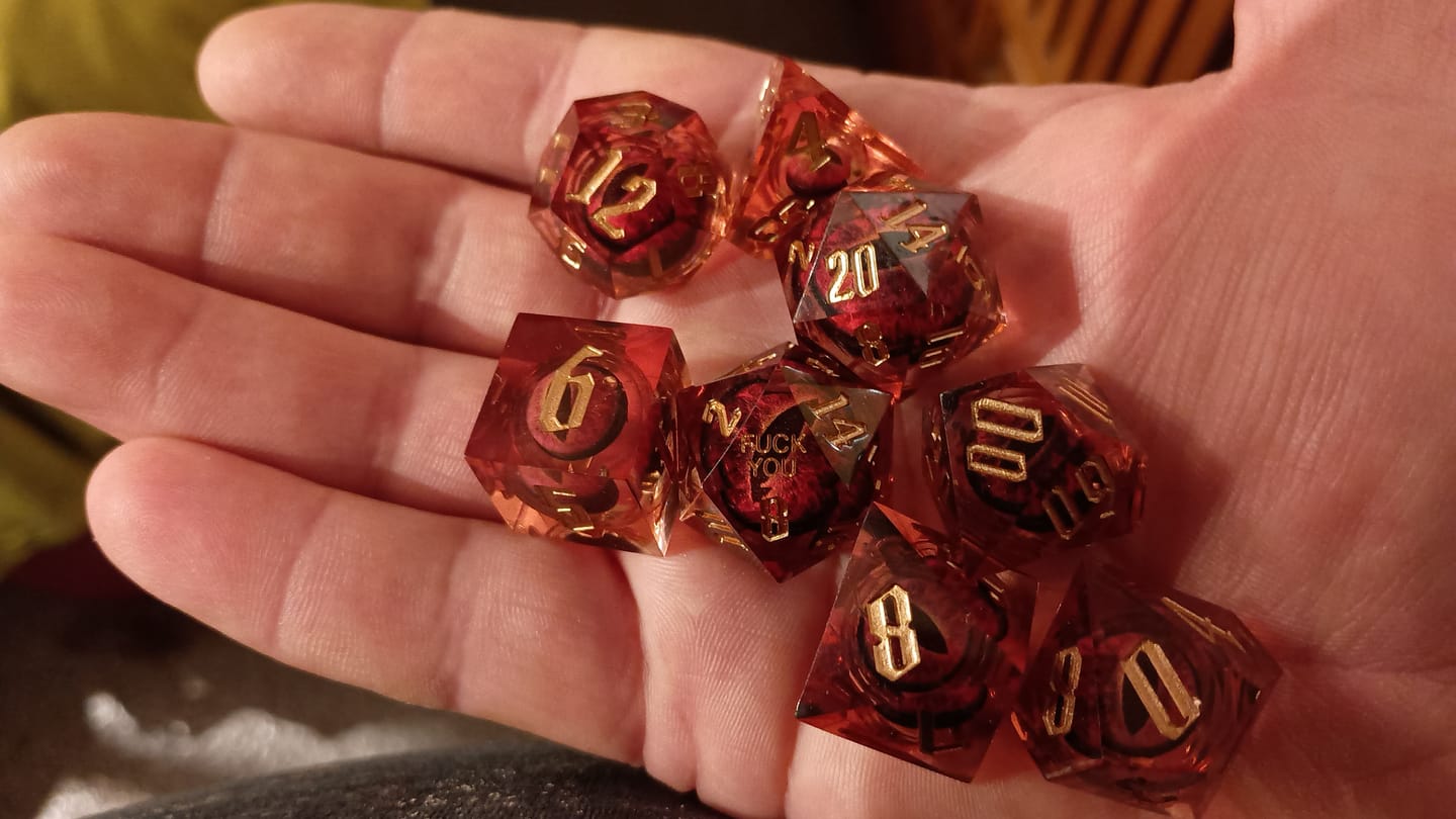 Customer photo review of F*ck Me Sharp Edge Dice Set