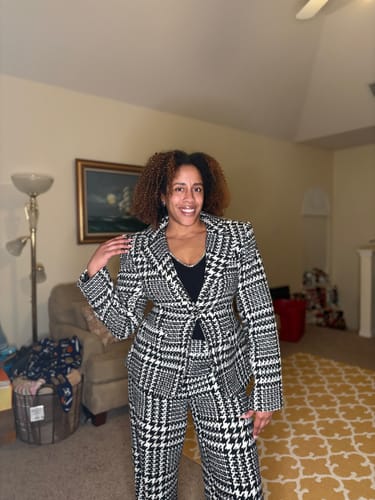 Reviewer posing indoors wearing the tailored Houndstooth Plaid Suit Blazer and matching pants.
