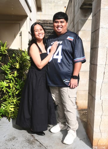 Reviewer showing the snug fit of their blue Philippines Heritage Custom Football Jersey while standing with another person.