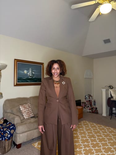 A closer view of the customer wearing the brown Power Shoulder Fitted Suit Blazer, showing the fit and details.