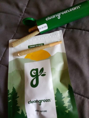 Customer's Cherry Dosi Do Pre-Rolls with the product pouch and a green carrying tube.