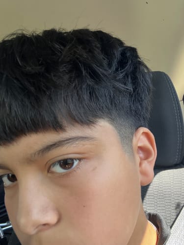 Reviewer's close-up photo showing their hair styled with texture and hold from the Texture & Hold Duo.