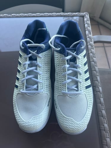 Reviewer's pair of Express Light Pickleball-2E shoes on a table, showing the high-rise mesh uppers and navy collars from a top-down view.