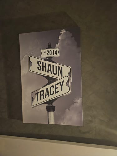 Customer's personalized 'Date of Love' canvas with street signs for 'Shaun,' 'Tracey,' and 'Est. 2014' in black and white.