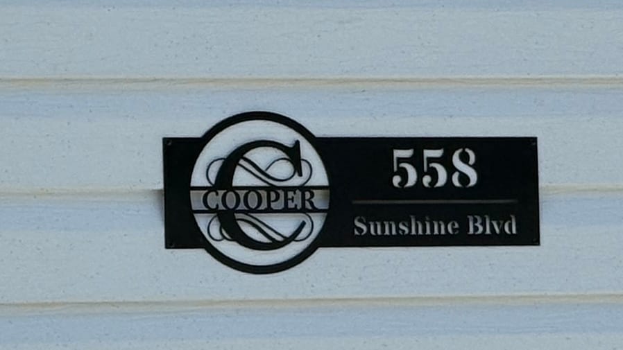 Customer photo review of Family Name Address Metal Sign