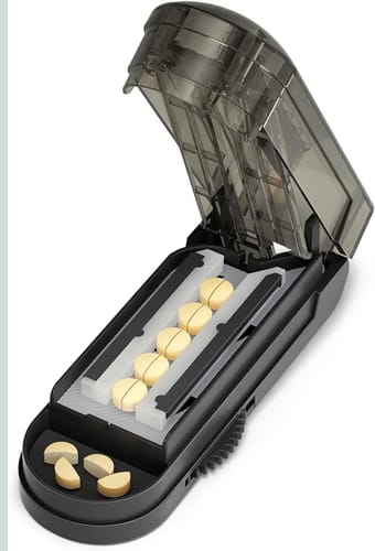 Customer's black pill splitter with Just Blue™ troches inside, some cut in half.