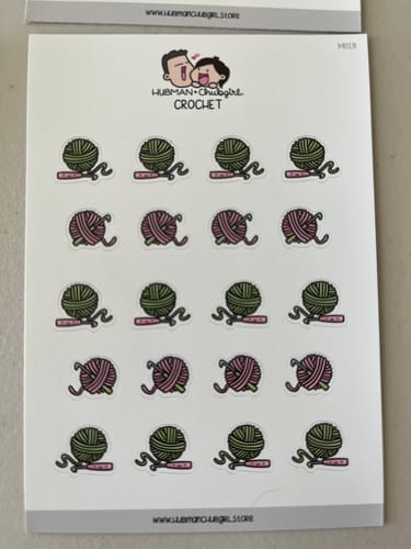 Customer's full sheet of Crochet Planner Stickers with colorful illustrations of yarn balls and crochet hooks.