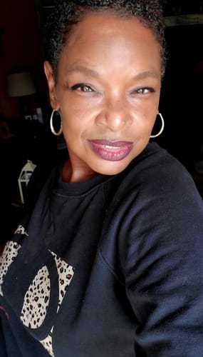 Close-up of the reviewer's face, showing clear, glowing skin after using the Turmeric Fade & Glow Bar.