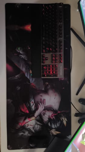 Customer's large iD Colossus mousepad with a custom art print, shown on a desk with a backlit keyboard.