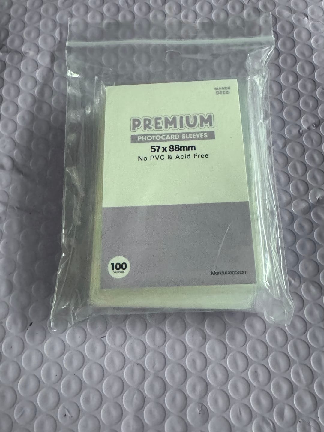Customer photo review of PREMIUM PHOTOCARD SLEEVES - PURPLE VERSION (57x88MM)