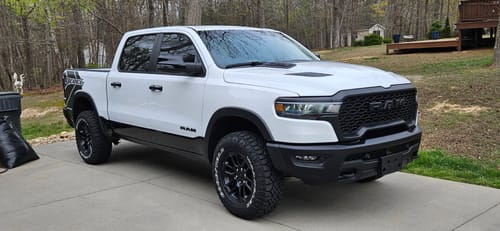 Customer's white Ram Rebel truck with a wider stance after installing the 1.5 inch hubcentric wheel spacers.