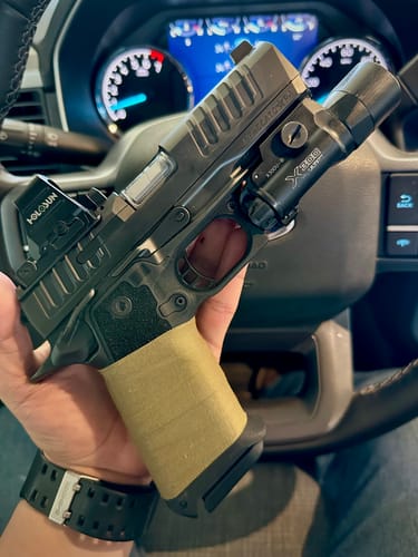 Reviewer shows the tape-wrapped pistol grip mentioned in their review for the Medical Shears.