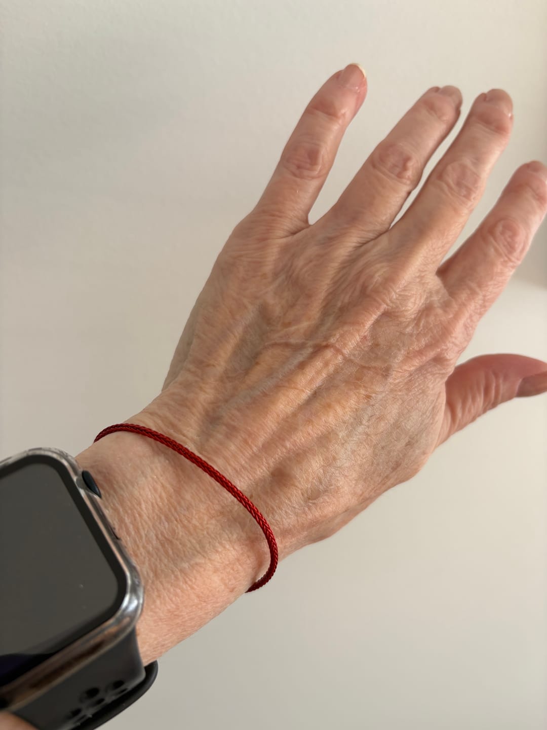 Customer photo review of Protective Red Cord Silver Bracelet