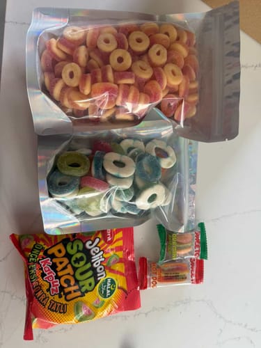 Reviewer's bag of Blue Raspberry Rings shown with other assorted candies from their order.