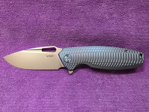 Customer photo review of Kubey Tityus Frame Lock Pocket Knife Titanium 14C28N 3.39"