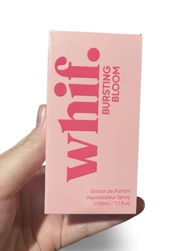 Customer holding the pink box for the Bursting Bloom perfume by Whif.