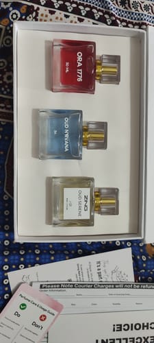 Customer's OUD Supreme BUNDLE showing the three included perfumes—Ora 1776, Oud Nirvana, and Oud Serene—in the open box.