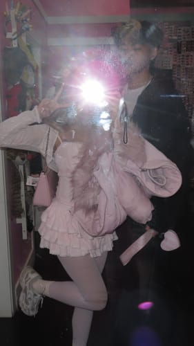 Partial view: Reviewer in a mirror selfie wearing the pink My True Form Cotton Cami Top as part of a layered outfit.