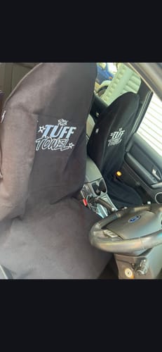 Customer's two black Waterproof Car Towel Seat Covers installed on the driver and passenger seats of a car.
