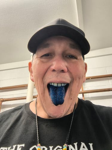 Reviewer showing their tongue stained a vivid blue after taking Meraki Blu Methylene Blue.