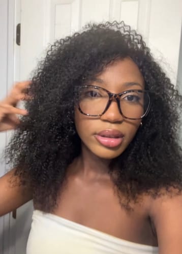 Customer photo review of CurlyMe Pre-bleached Wear Go Glueless Afro Kinky Curly Pre-cut HD Lace Wig Pre-plucked