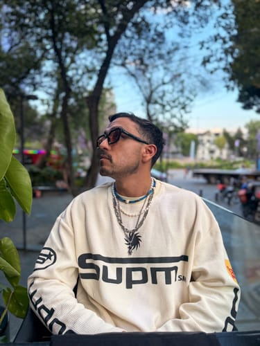 Reviewer sitting outdoors in the oversized cream Textured Waffle Long Sleeve T-Shirt.