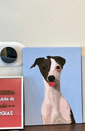 Reviewer's completed Paint Your Pet by Numbers portrait of a black and white dog with its tongue out.
