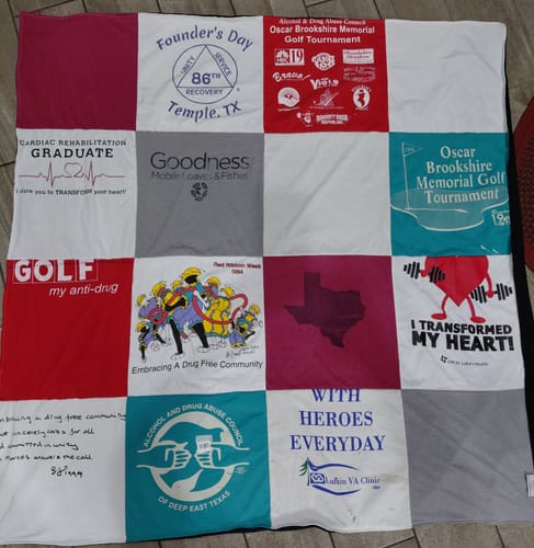 Customer's finished Project Repat T-Shirt Quilt, a sentimental patchwork of various t-shirts.