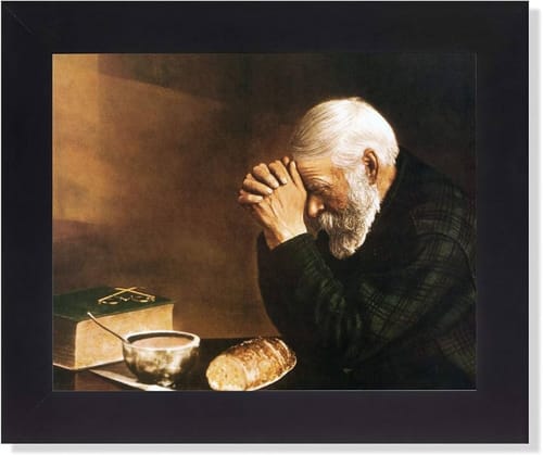 Customer's finished Custom Paint by Numbers Kit showing a framed painting of an elderly man praying over a meal.