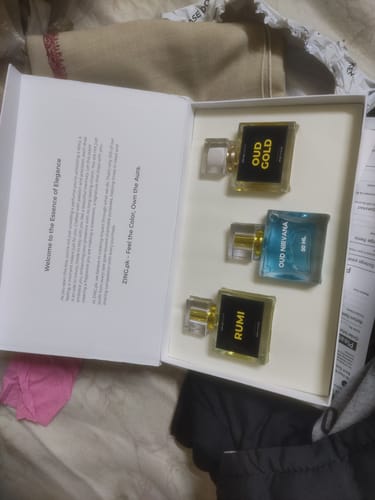 Customer's unboxed OUD Supreme BUNDLE, showing three different perfume bottles inside the white case.