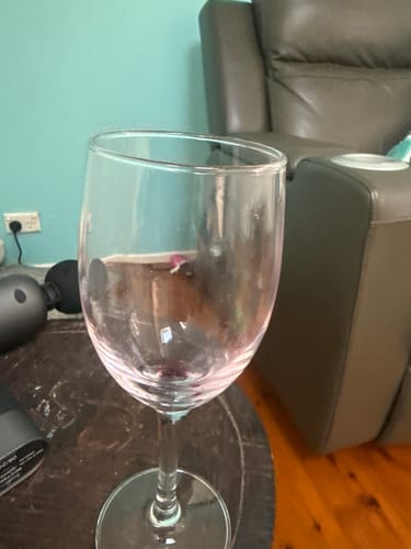 A reviewer's nearly empty glass after enjoying the Mixed Red wine.