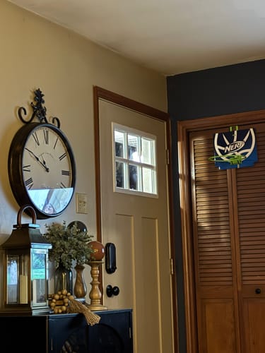 Customer's beige door with the Clear 6 Lite Glass and Frame Kit installed, shown in a decorated entryway.