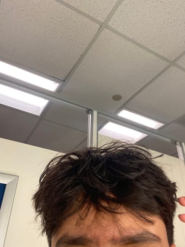 Close-up of a customer's hair showing the styled texture and volume from the Texture Powder.