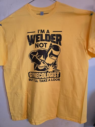 Reviewer shows a finished yellow t-shirt with a smooth, black DTF transfer, made following the guide.