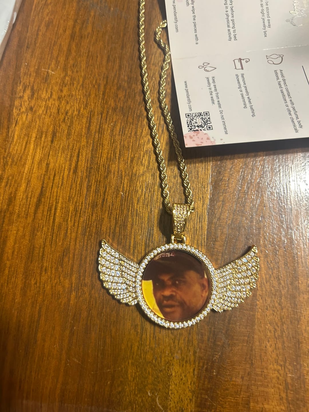 Customer photo review of Diamond Studded Angel Wing Photo Necklace