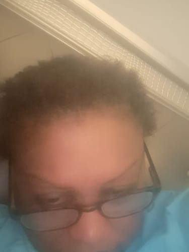 Close-up: Reviewer's dark hair after using the Instant Dye Shampoo, showing no visible gray.