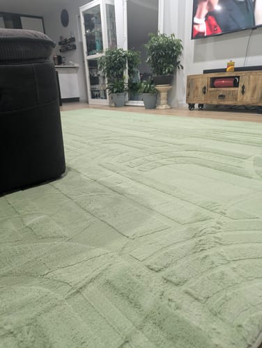 Customer's large Pistachio Green Mellow Mat with a carved pattern filling their living room floor.