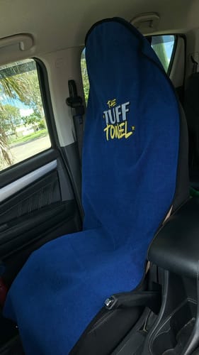 Customer's blue Tuff Towel seat cover protecting the front seat of a car.