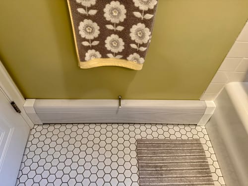 Customer photo review of Tall White Baseboard Covers by the Foot