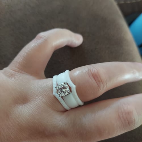 Close-up of a reviewer wearing the white Silicone Ring Stackable Set with a sparkly CZ stone.