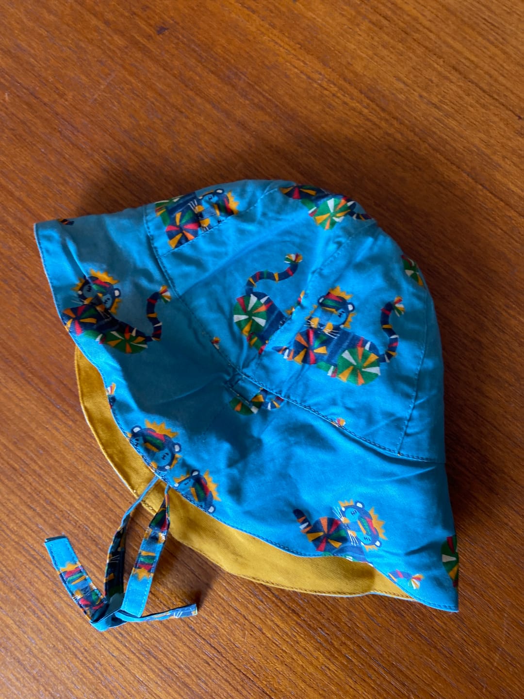 Customer photo review of Rainbow Tigers & Gold Reversible Sunhat
