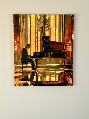 Customer's finished art deco style painting of a person at a piano, created using the custom paint by numbers kit.